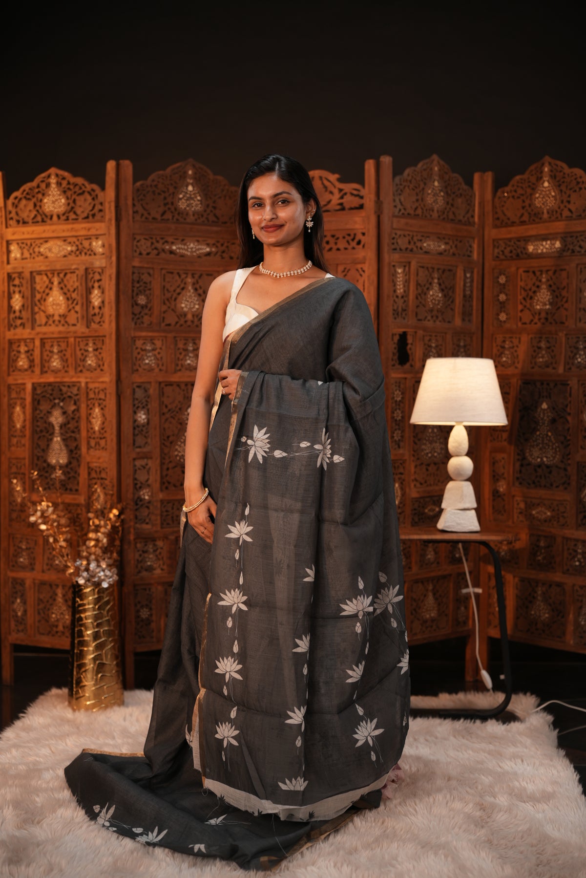 Dark Green colour Semi Linen saree featuring plain & lotus print, Bavanchi border & same print on Pallu, comes with contrast colour blouse piece.