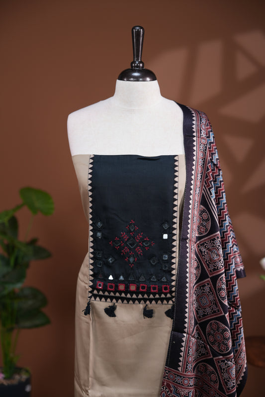 Cream colour Jam Satin salwar material, Plain body with mirror & thread work on neck portion, matching bottom and Dupatta with ajrak print.