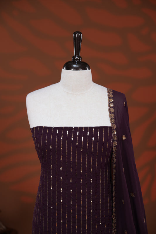 Grape colour Georgette salwar material featuring Sequins Stripes on body, paired with matching dupatta on scallop border & Santoon bottom.