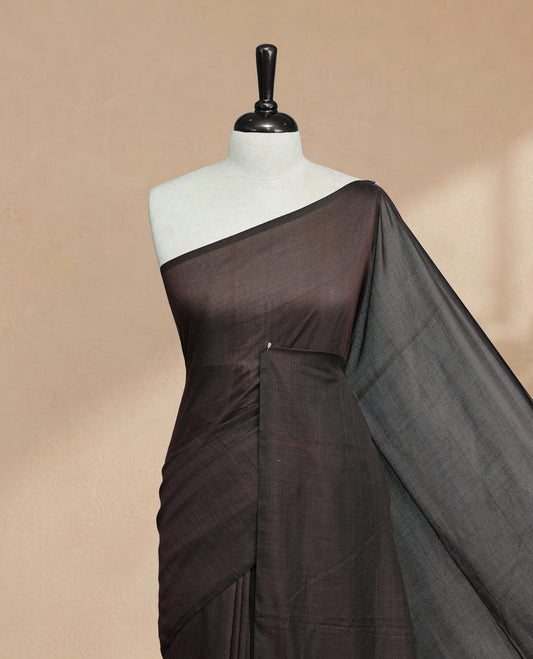 Chocolate Colour Mul Cotton saree featuring Elegant plain body, Comes with no border, finished with stylish tassels.
