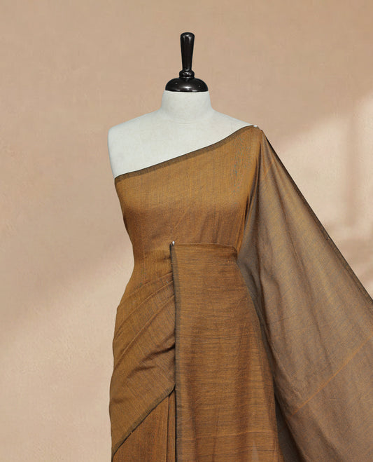 Mustard Colour Mul Cotton saree featuring Elegant plain body, Comes with no border, finished with stylish tassels.