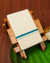 Cream colour cotton Single dhoti featuring Teal simple border.