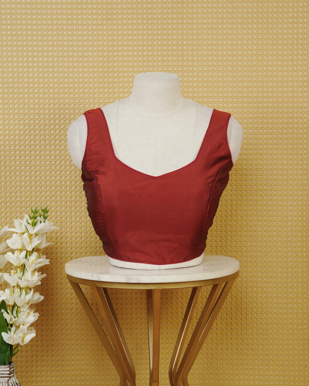 Dark red colour Sleeveless Blouse Featuring A Stylish Sweetheart Neck, Smooth Finish, And A Comfortable Tailored Fit.
