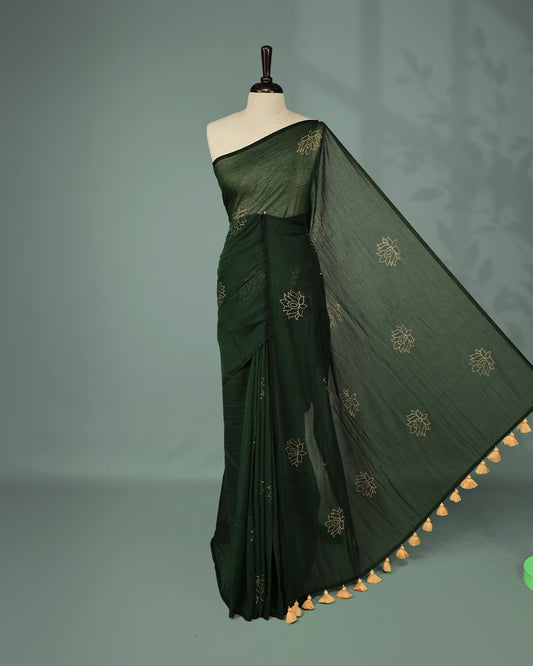 Bottle Green colour pure mul cotton saree featuring Minimal Lotus Print on body, Clean Borderless design, elegant tassels.
