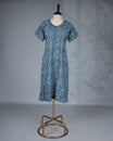 Greish Blue colour printed nighty featuring a graceful U-neckline with delicate lace trim, short sleeves and Mid-lenght fit.