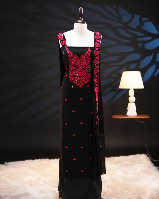 Black colour georgette salwar material featuring elegant threadwork on the body and intricate threadwork with sequin detailing on neckline, paired with a scalloped border dupatta and Shantoon bottom