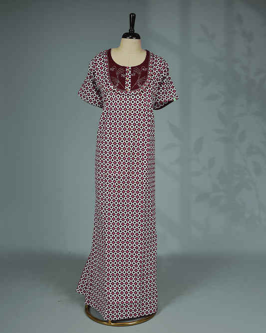 Maroon & White printed nighty featuring an elegant round neckline with embroidered yoke and decorative button detailing, short flutter sleeves and a relaxed full-length fit