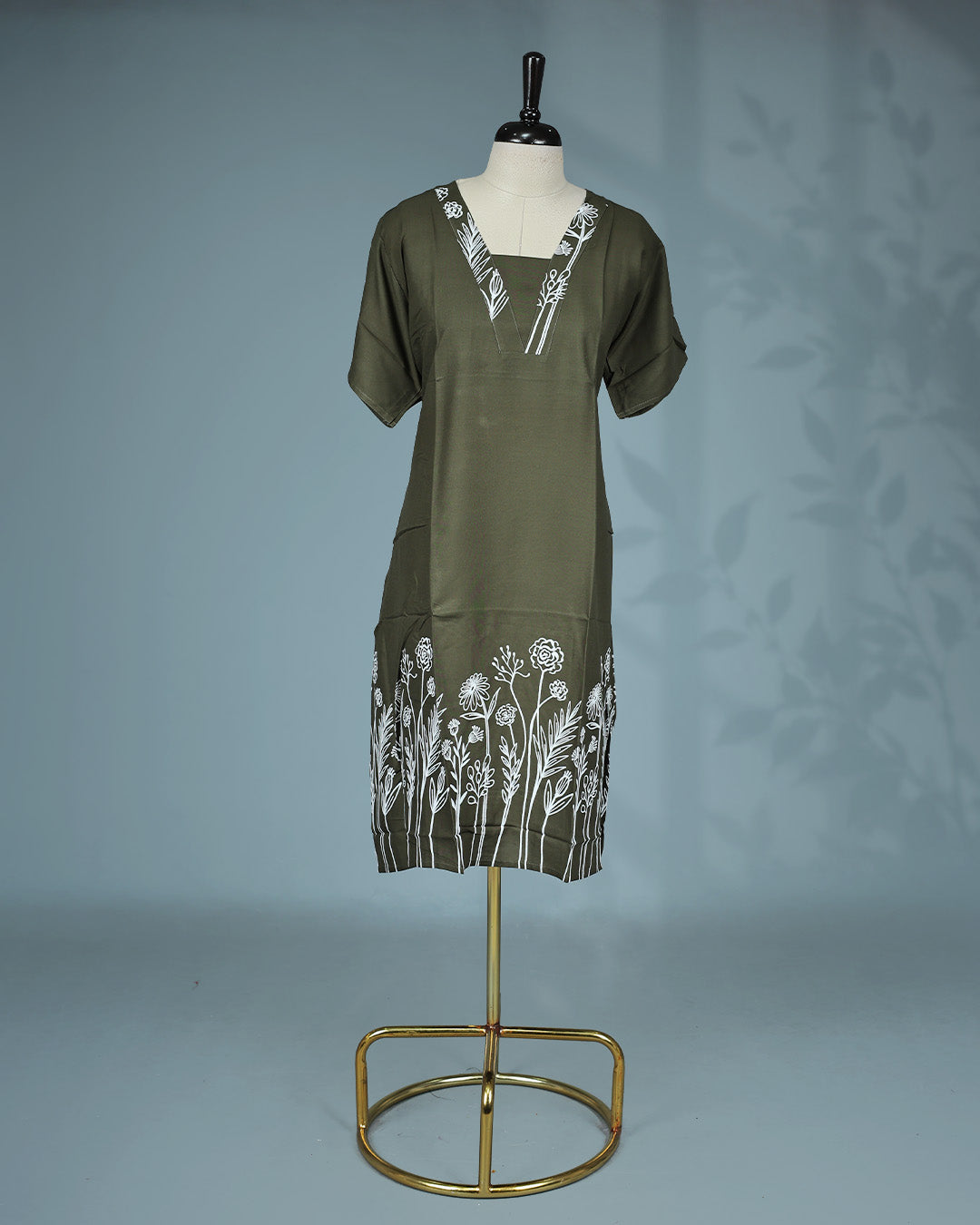 Dark Olive Green colour nighty featuring white floral prints on the V-neckline and hem, short sleeves and a Mid-length fit.