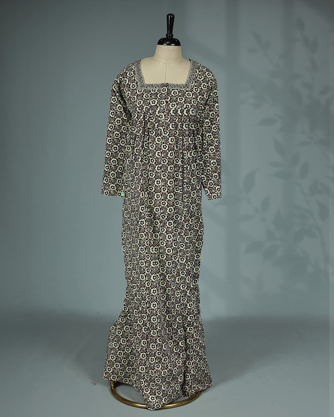 Brown & cream floral printed nighty with an elegant square neckline full sleeves, delicate printed border detailing, front button placket and a graceful full-length fit.