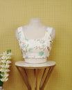 White Floral Print Sleeveless Blouse Featuring A Classic Scoop Neck, Delicate Ice Blue Floral Print, And A Comfortable Tailored Fit.