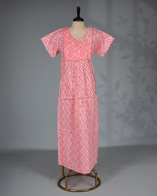 Light Red colour printed nighty with a stylish contrast asymmetrical yoke, V-neckline, short sleeves and a relaxed full-length silhouette for comfortable everyday wear with a modern touch.