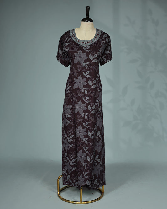 Dark brown floral kodi printed nighty featuring a round embroidered neckline with contrast grey yoke detailing, short sleeves and a comfortable ankle-length fit.
