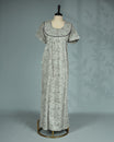 Light Grey colour nighty featuring floral prints on body, an openable button-front round neckline with black lace trim, short sleeves and an ankle-length fit.