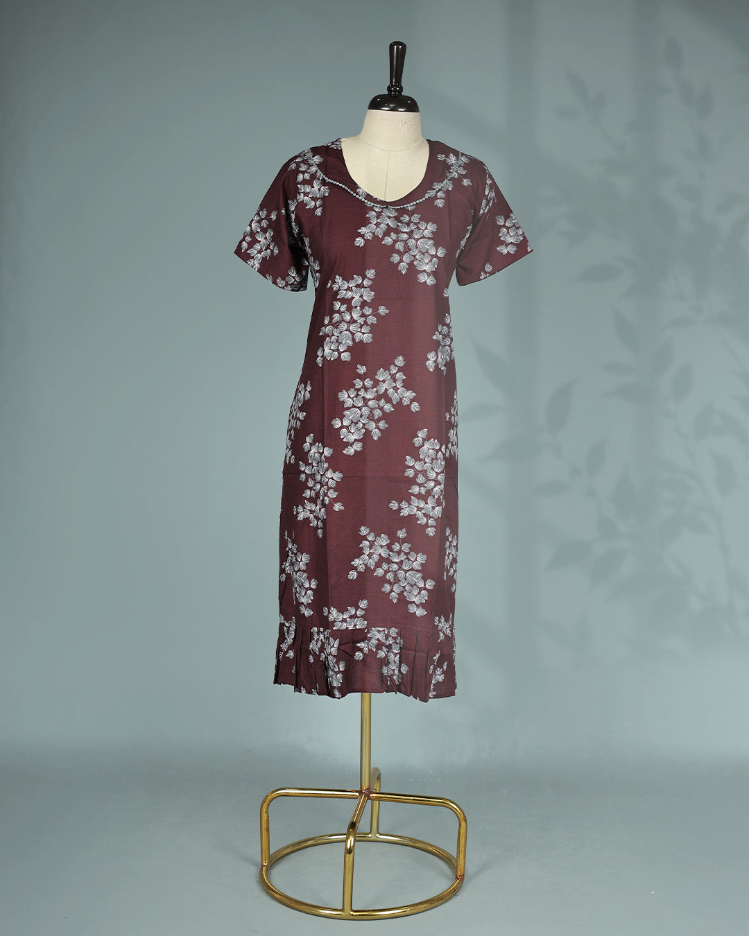 Maroon floral kodi  printed nighty with a classic scoop neckline, short sleeves, delicate lace trim detailing along the neckline, and a relaxed midi-length for everyday comfort and effortless elegance.