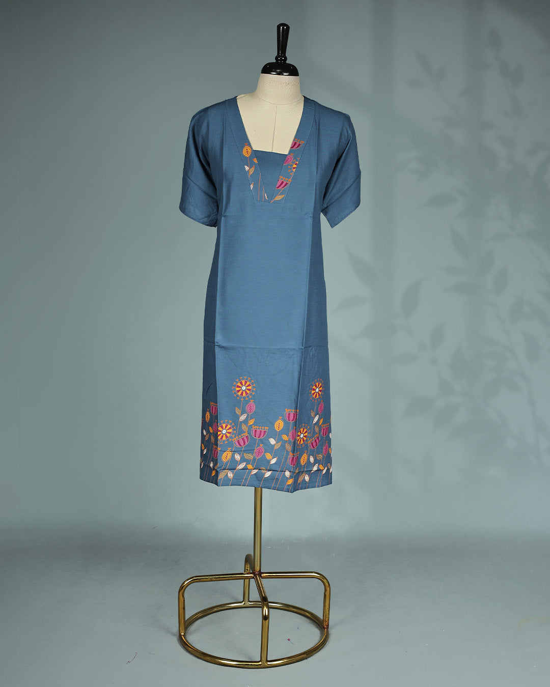 Elegant slate blue solid nighty featuring a stylish V-notch neckline with colourful floral embroidery, short sleeves and a comfortable Mid-length relaxed fit