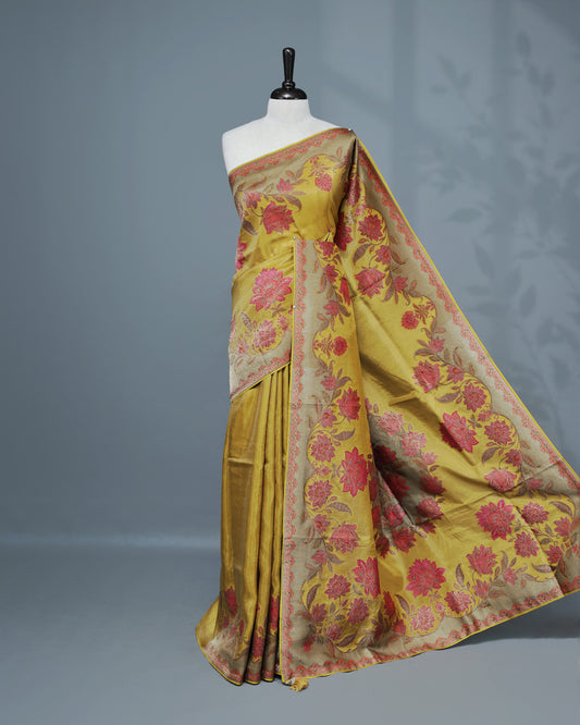Olive yellow Colour Pashmina Saree featuring Plain body, complemented by Contrast colour with Floral pattern & gold zari on border and Pallu, comes with matching blouse piece.