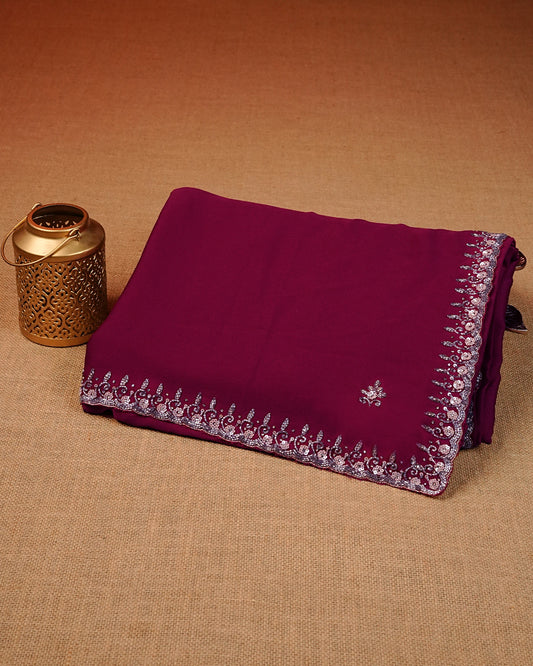 Maroon colour Chiffon Designer saree featuring Beats & Sequins Motifs on body and worked border, comes with matching blouse piece.