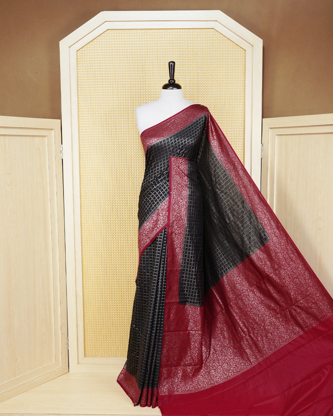 Black Colour Semi georgette Saree having zari dotted check pattern on body, contrast Red colour floral kodi designed Border, Rich Pallu comes with Matching Blouse piece.