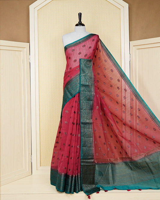 Dark maroon colour semi linen saree thread motifs on body, contrast bottle green colour gold zari border, rich pallu comes with matching blouse piece