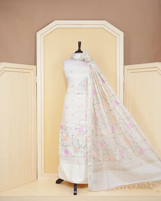 Cream colour tissue salwar material featuring beautiful floral embroidery design with elegant border, paired with matching bottom and beautiful dupatta.