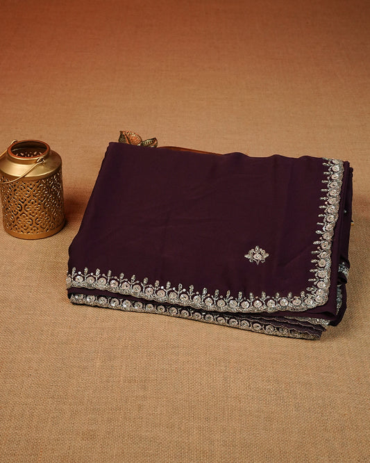 Chocolate brown colour Chiffon Designer saree featuring Beats & Sequins Motifs on body and worked border, comes with matching blouse piece.