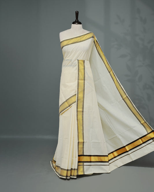 Cream colour Kerala saree Featuring an Elegant plain body, complemented by a classic gold & black zari border, matching blouse piece.