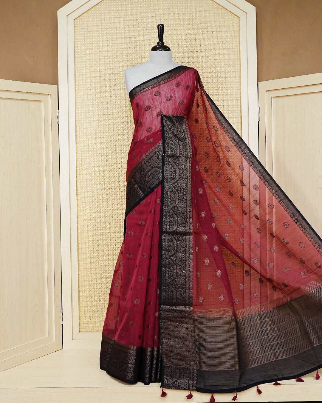 Dark magenta colour semi linen saree thread motifs on body, contrast dark colour gold zari border, rich pallu comes with matching blouse piece
