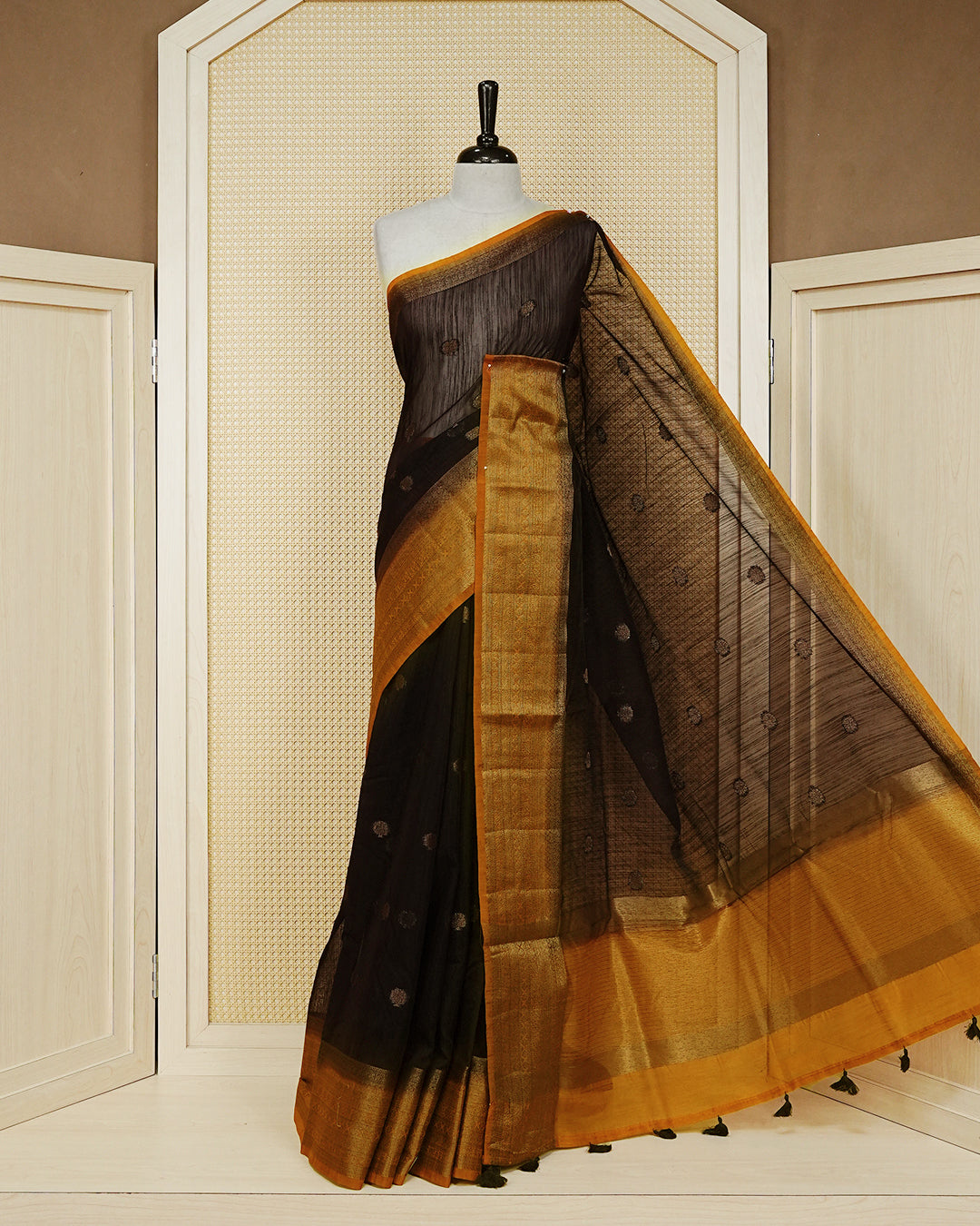 Dark brown colour semi linen saree thread motifs on body, contrast mustard orange colour gold zari border, rich pallu comes with matching blouse piece