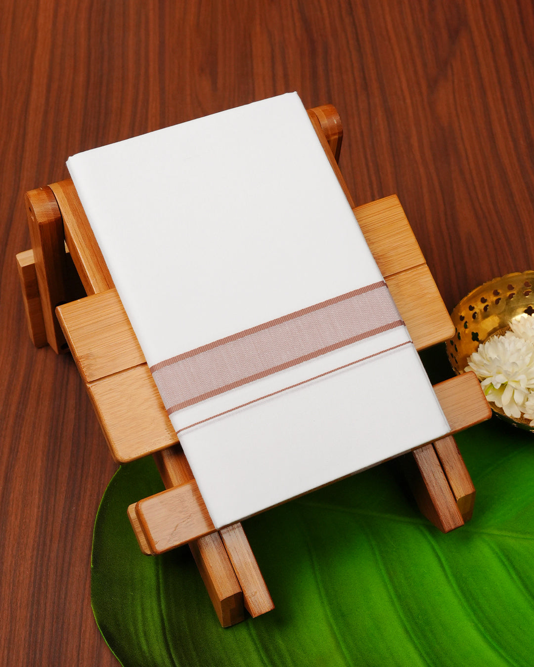 White colour cotton single dhoti featuring Light brown border.