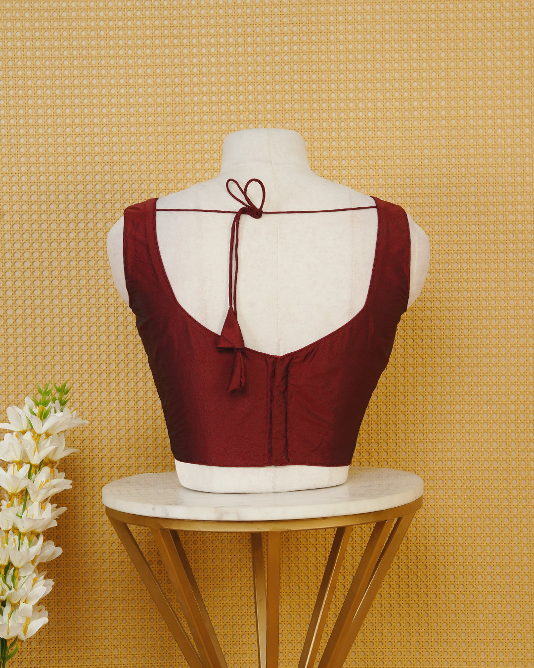 Maroon colour Sleeveless Blouse Featuring A Stylish Sweetheart Neck, Smooth Finish, And A Comfortable Tailored Fit.