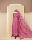 Dusty pink colour Tussar Salwar material featuring Threadwork on the body, paired with a matching bottom and an elegant dupatta.
