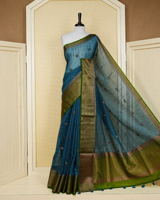 Peacock blue colour semi linen saree thread motifs on body, contrast mehndi green colour gold zari border, rich pallu comes with matching blouse piece