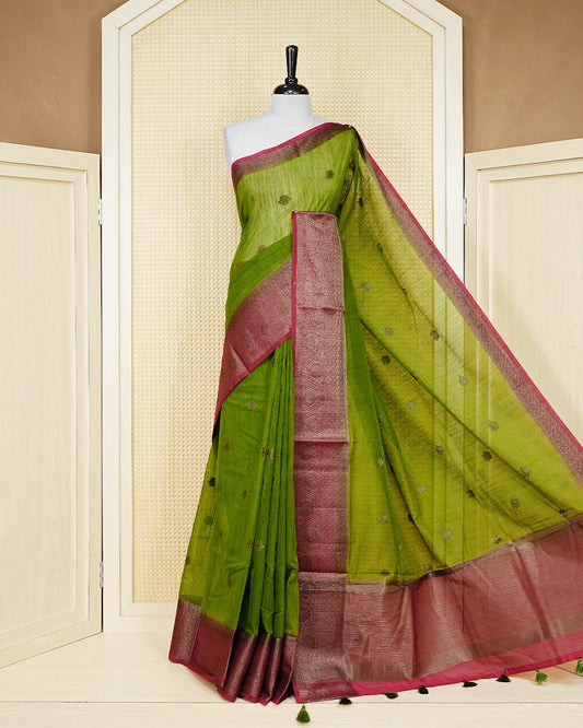Parrot green colour semi linen saree thread motifs on body, contrast pink colour gold zari border, rich pallu comes with matching blouse piece