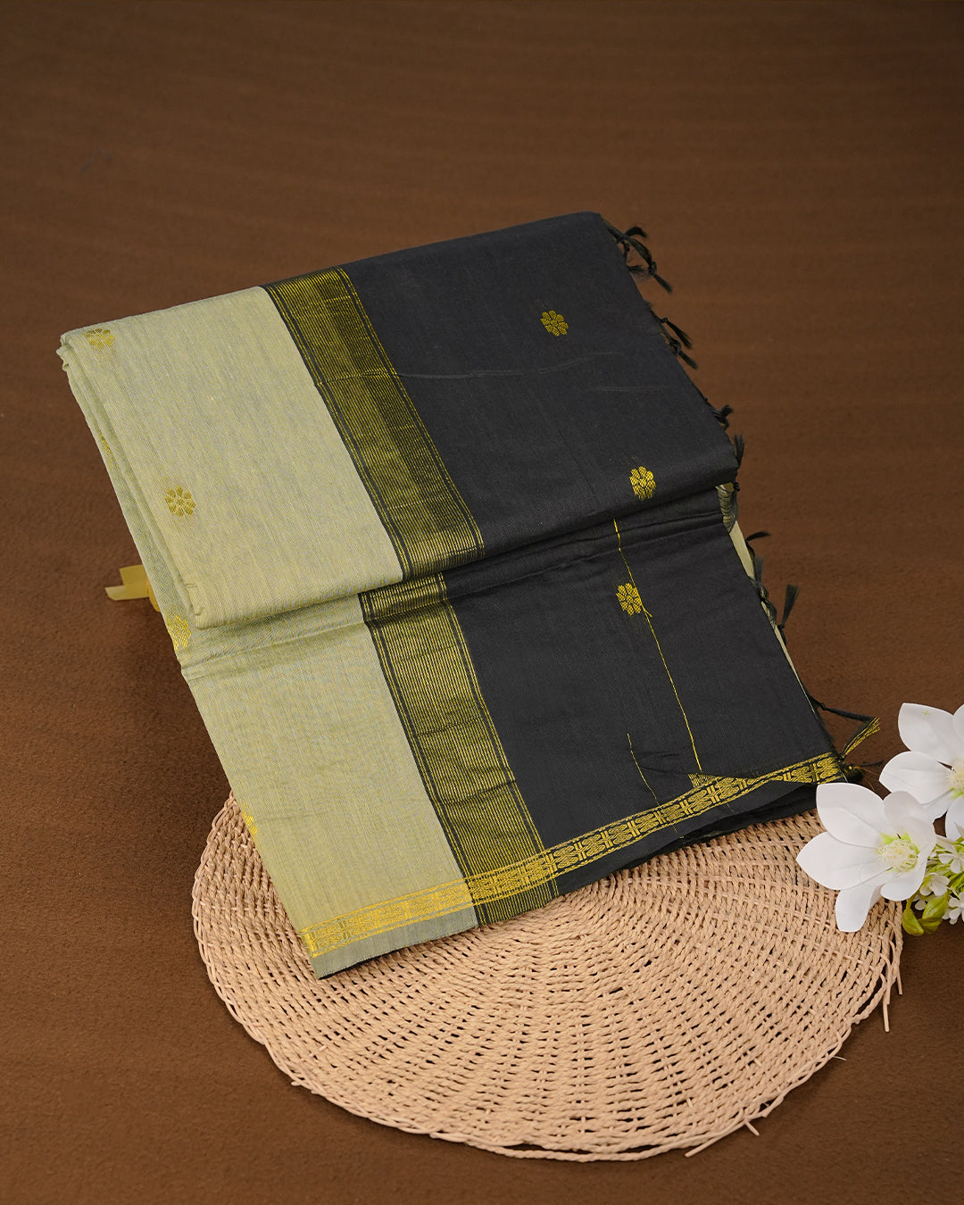 Pista Colour Kalyani Cotton Saree Featuring Gold Zari Floral Patterns on the Body, Complemented by a Black Colour Border with Stripes & Floral Gold Zari, Paired with a Matching Blouse Piece.