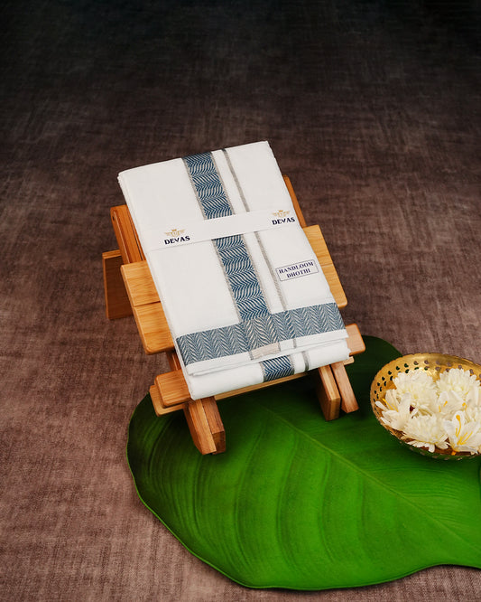 Off White Colour Pure Cotton Double Dhoti Finished With A Blue Designed Pattern On Silver kara.