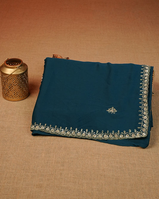 Teal colour Chiffon Designer saree featuring Beats & Sequins Motifs on body and worked border, comes with matching blouse piece.