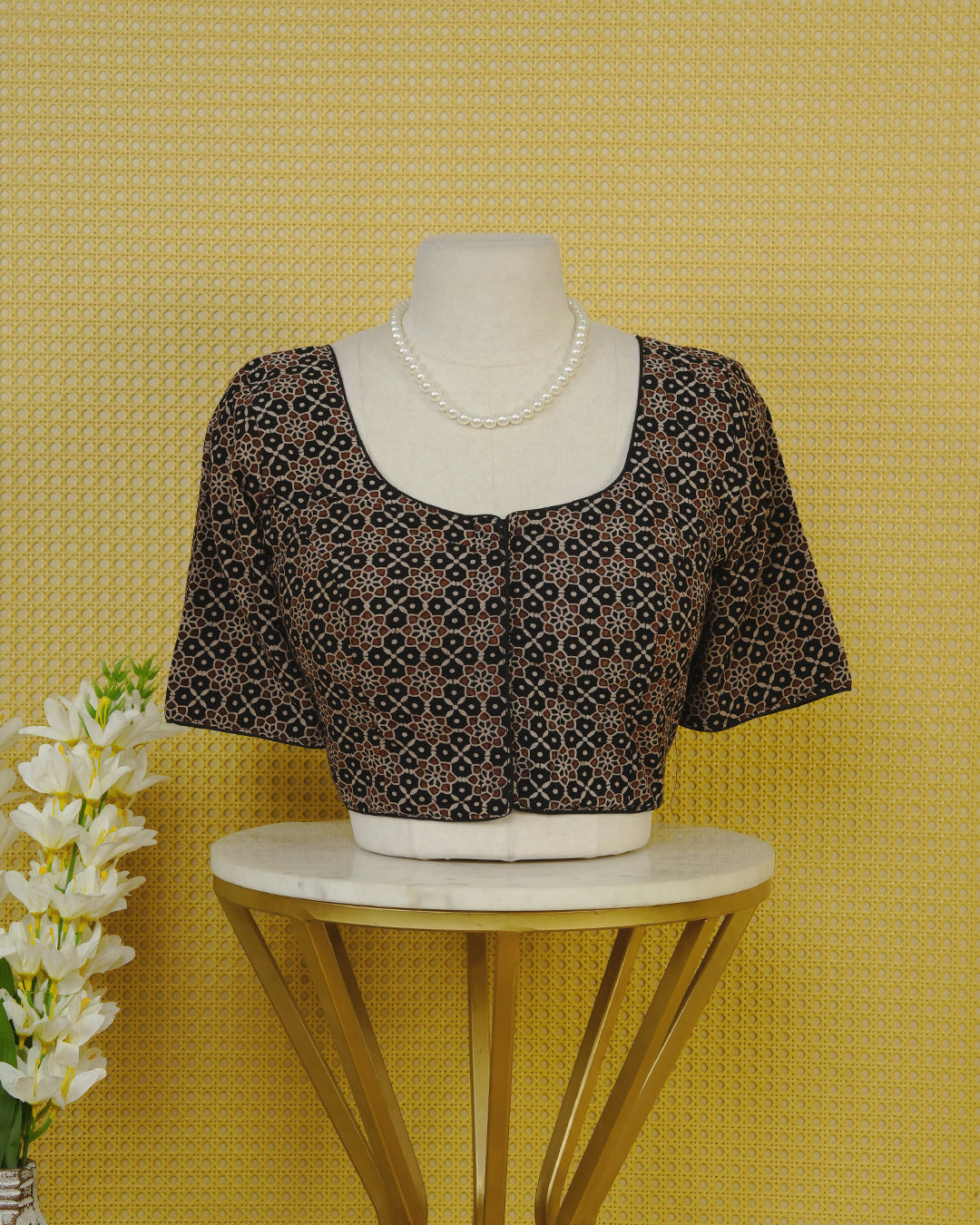 Black Colour Blouse Featuring A Classic U-Neck, Intricate Floral Geometric Print, And Comfortable Elbow Length Sleeves.