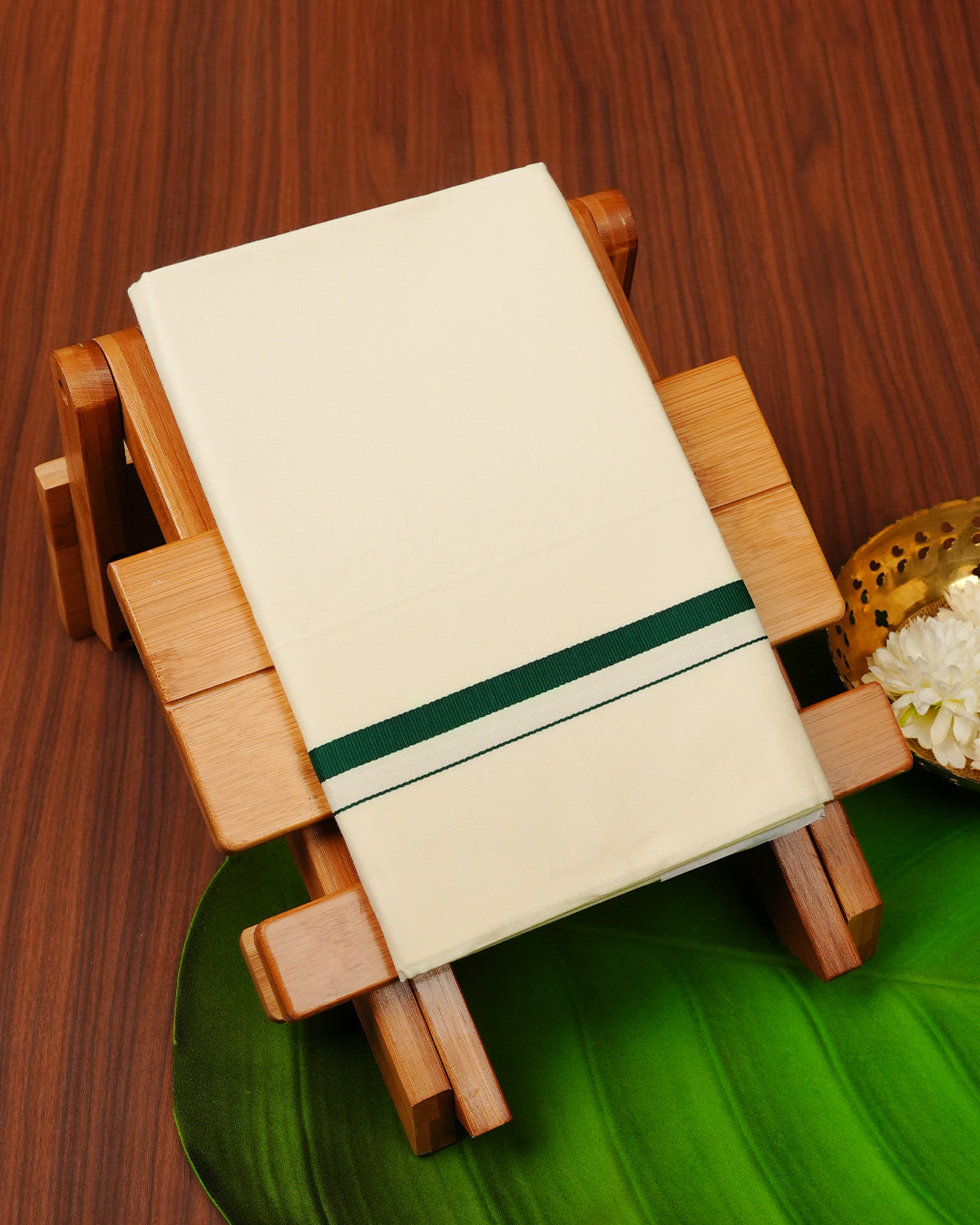Cream colour cotton Single dhoti featuring Green simple border.