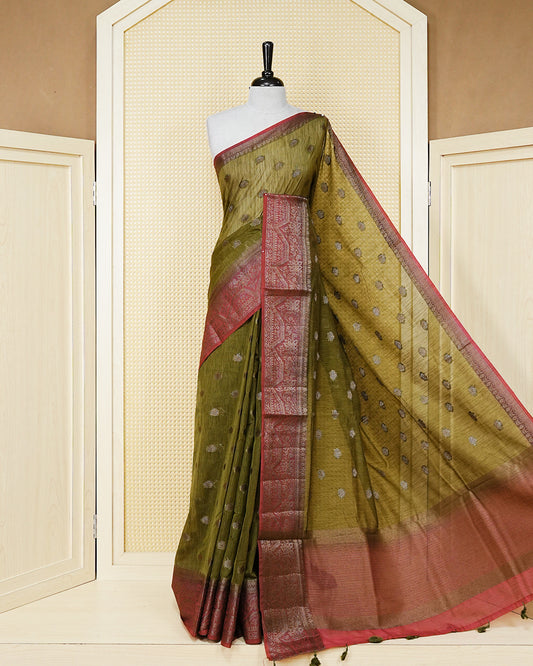 Olive green colour semi linen saree thread motifs on body, contrast pink colour gold zari border, rich pallu comes with matching blouse piece