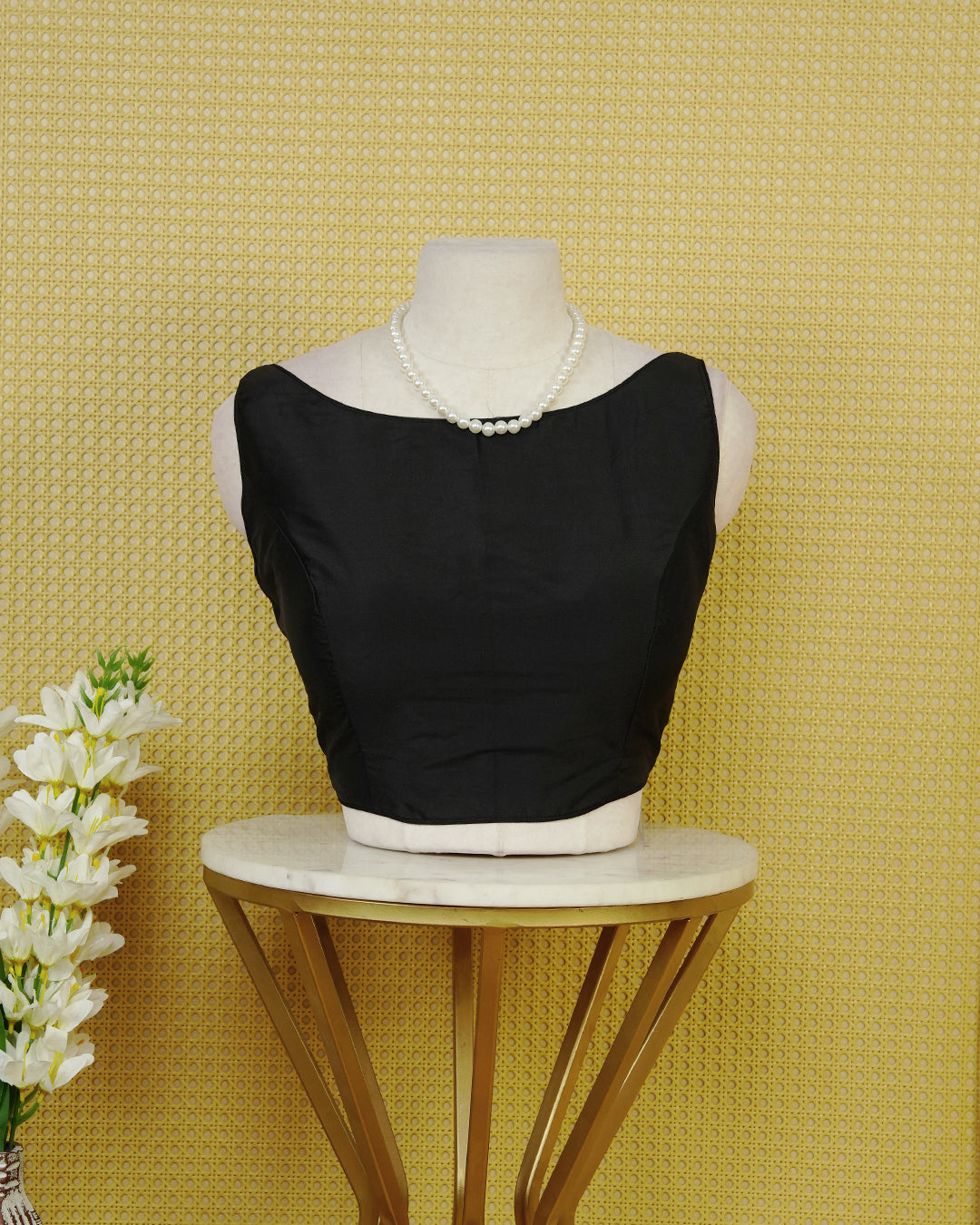 Black Colour Plain Blouse Featuring A Simple Boat Neckline, Sleeveless Design, And A Clean Fitted Silhouette.
