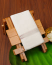 White colour cotton single dhoti featuring Light Gold with Maroon colour border.