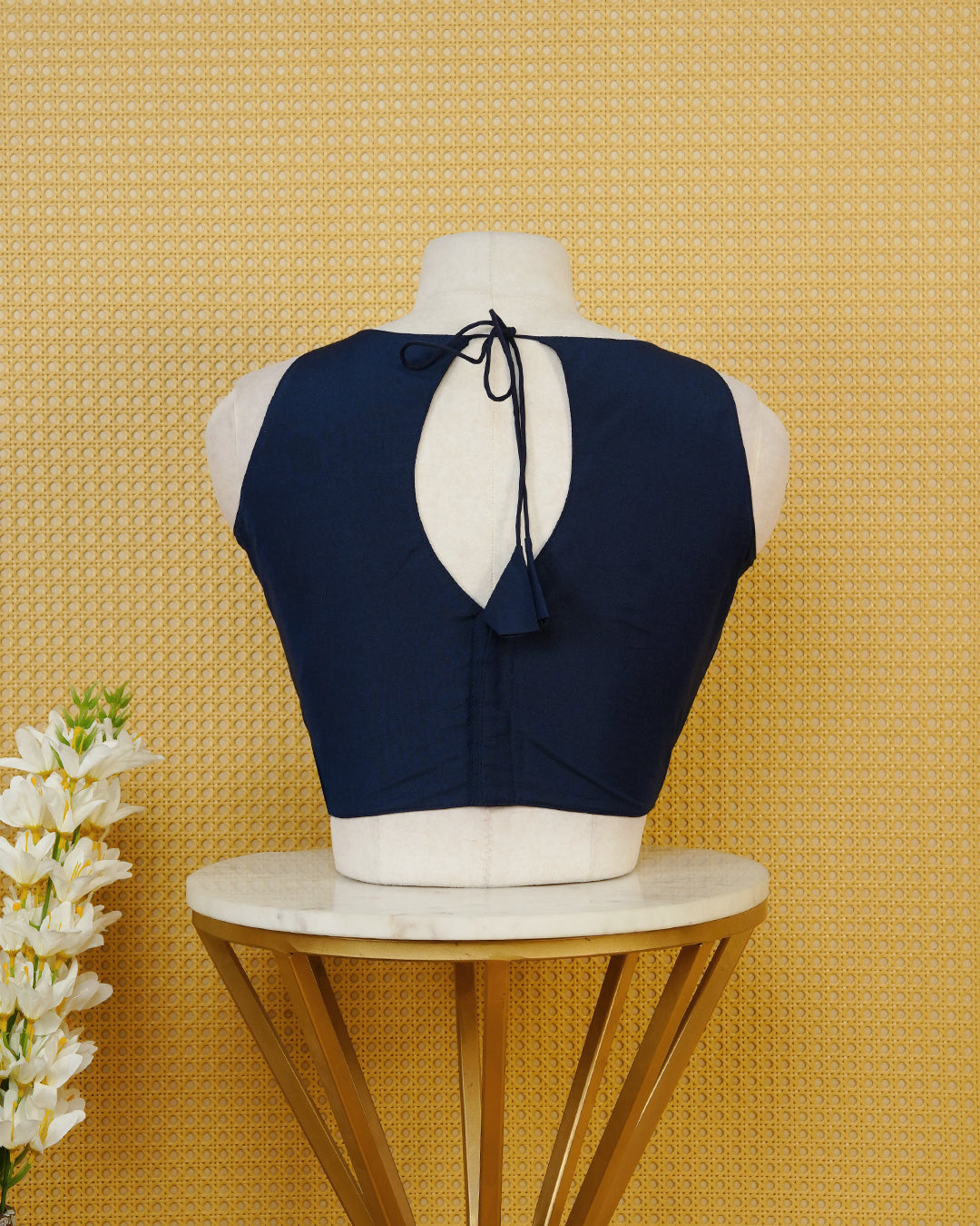 Navy Blue Plain Blouse Featuring A Classic Round Neckline, Sleeveless Design, And A Simple Fitted Silhouette.