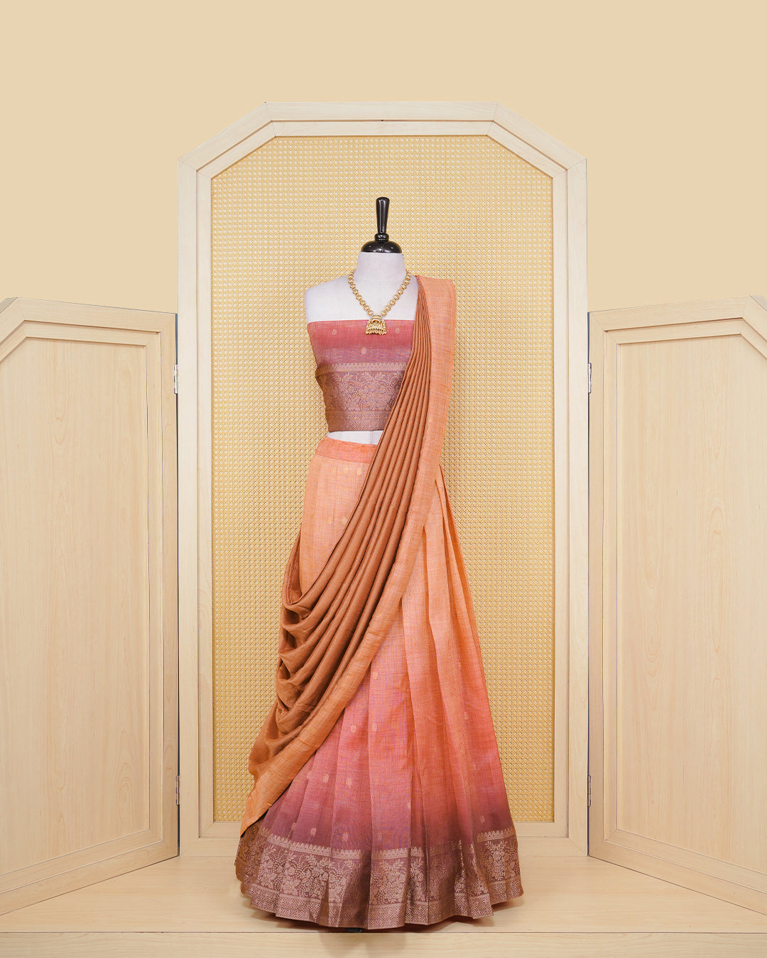 Burnt orange & maroon colour Linen Silk Semi stitched dhavani set featuring buttas, zari bordered skirt & blouse piece and dupatta.