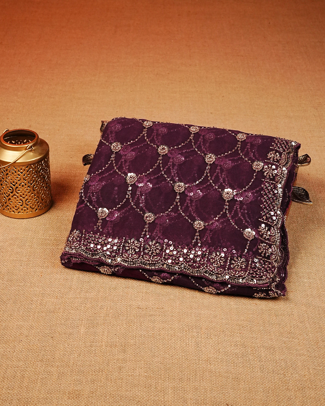 Purple colour Net Designer saree featuring Beats & Sequins geometric Pattern on body & worked border, comes with matching blouse piece.