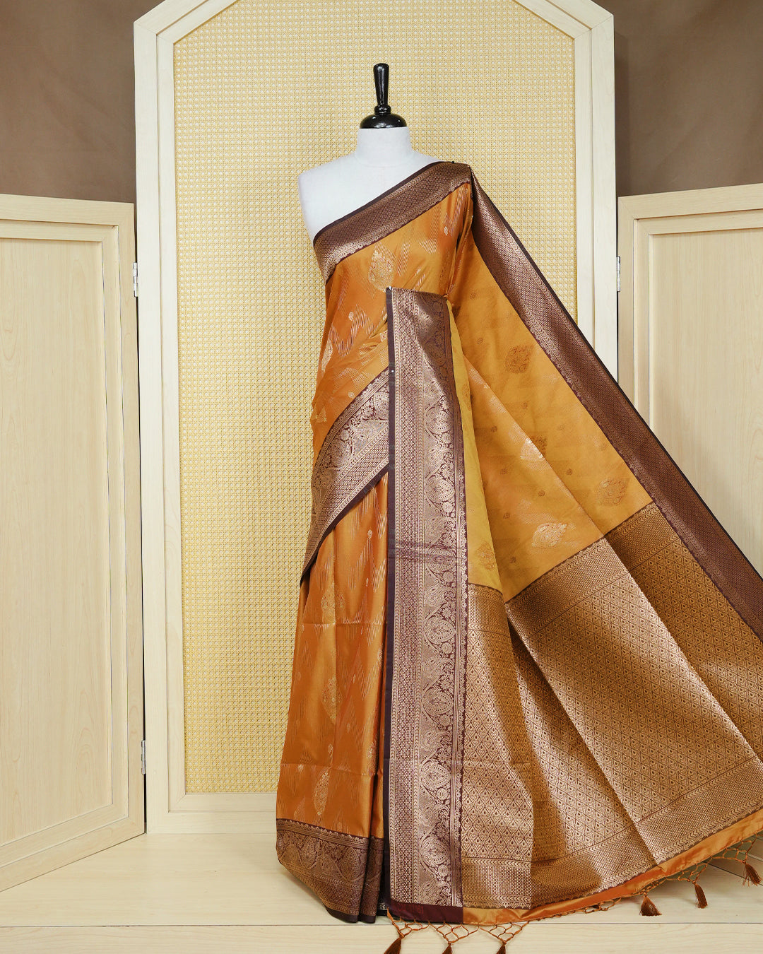 Copper & gold double shade Mulberry silk saree featuring floral gold zari patterns on body, paired with contrast teal colour with traditional border, comes with matching blouse piece.