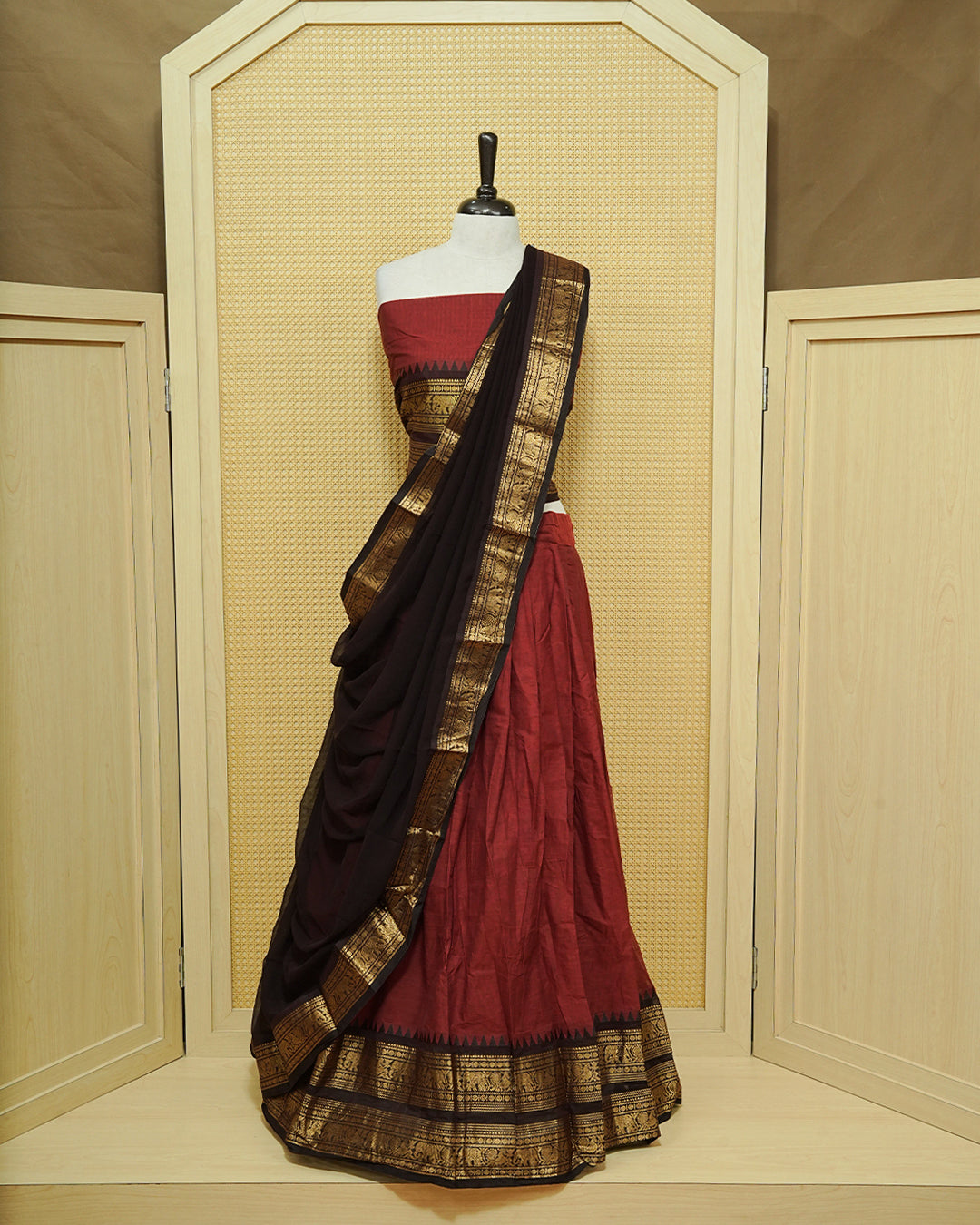 Maroon colour Chettinad Semi Stitched dhavani set Featuring contrast Black with Gold zari border on skirt, Contrast Blouse & matching dupatta.