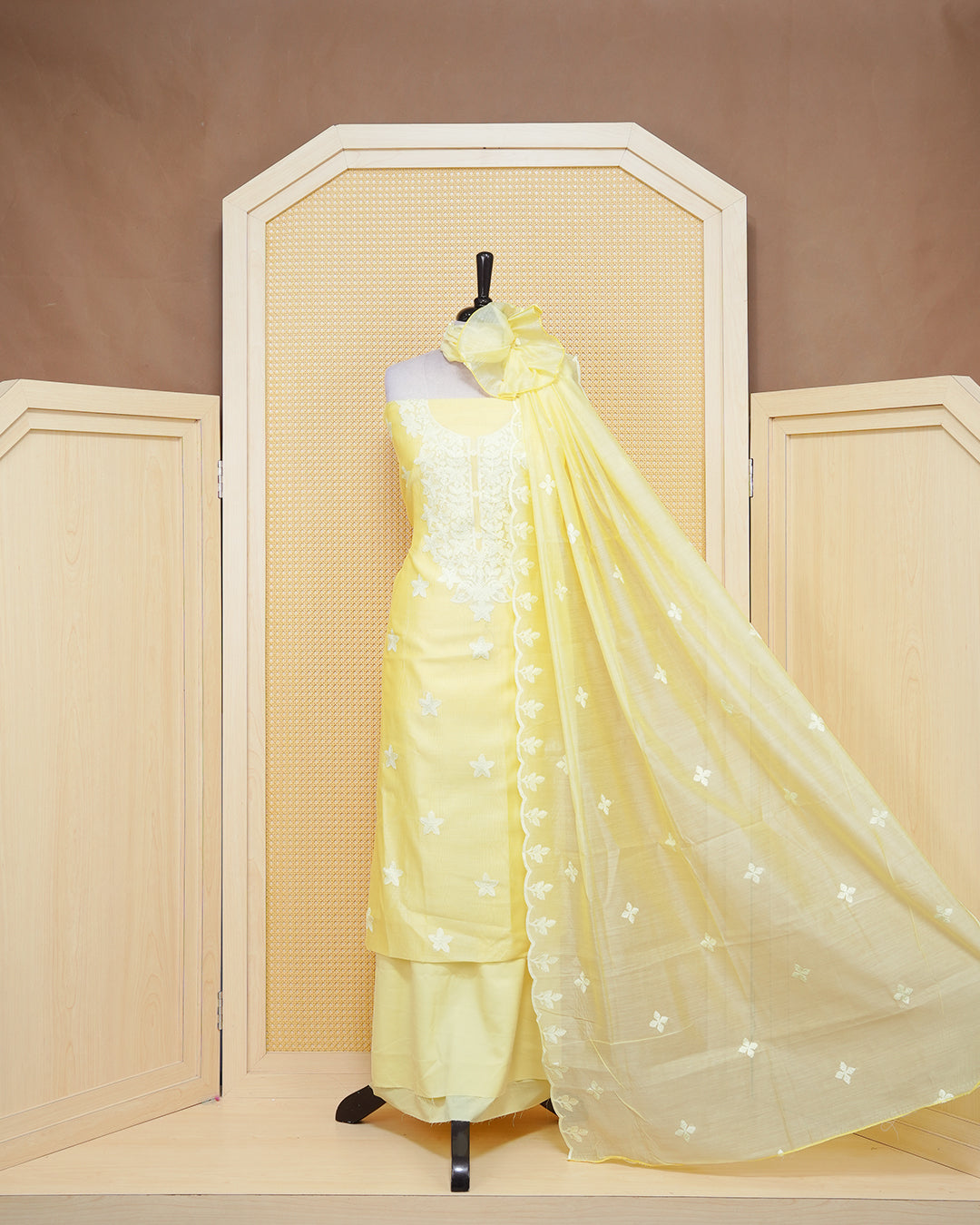Pastel yellow salwar material featuring chikkankari work on body, comes with matching Bottom piece & Dupatta