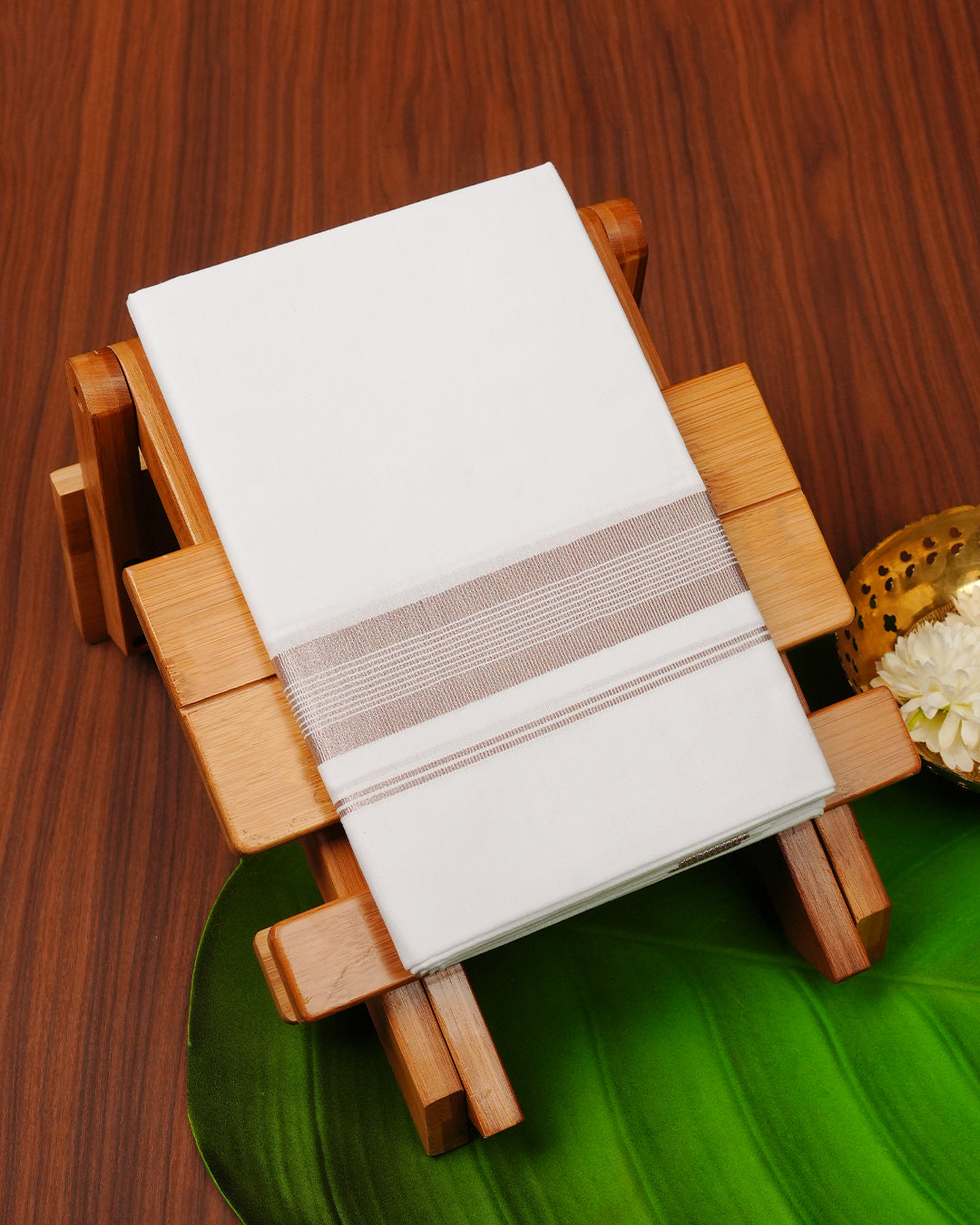 White colour cotton single dhoti featuring Rose Gold Kasav border.