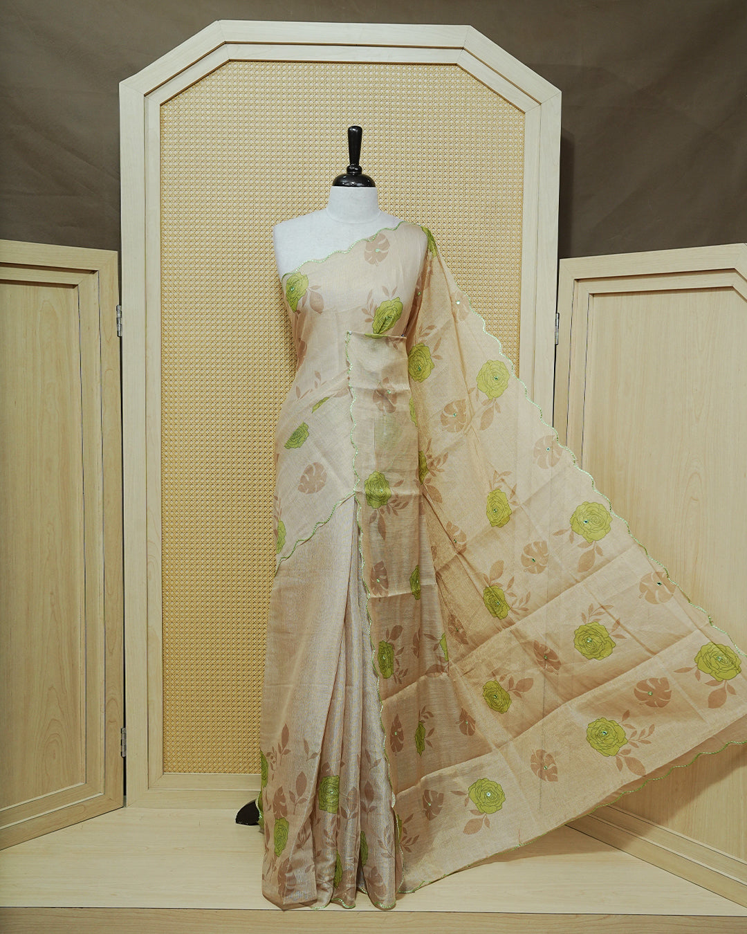 Green colour Semi tissue saree featuring elegant Rose print with delicate Mirror Work, beautiful Scallop border.