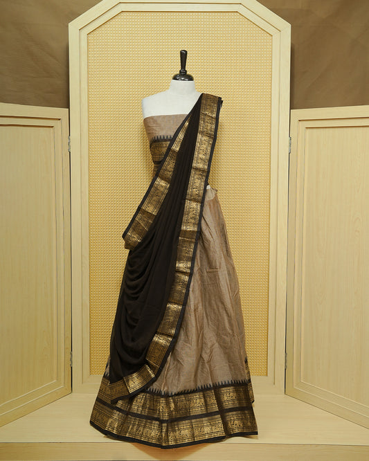 Grey colour Chettinad Semi Stitched dhavani set Featuring contrast Dark chocolate with Gold zari border on skirt, Contrast Blouse & matching dupatta.
